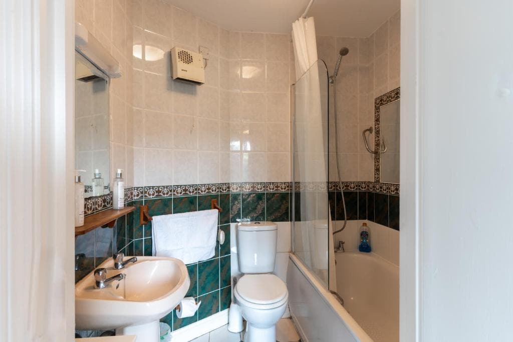 En suite bathroom with walk-in shower at Tully's Home